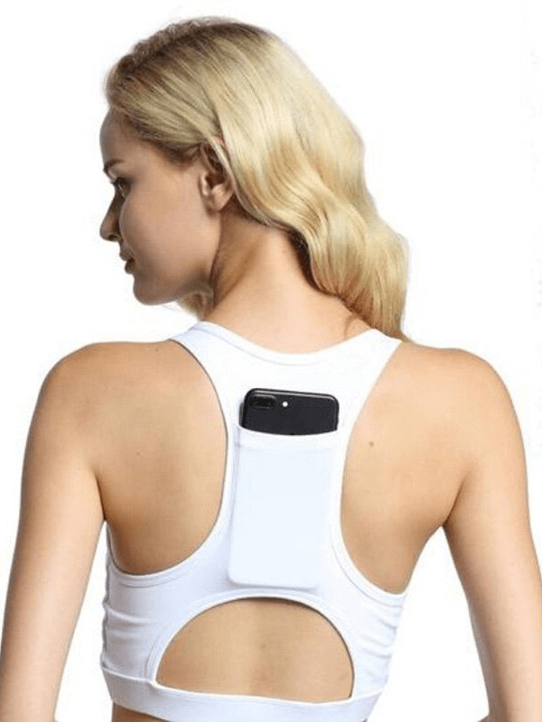 Model wearing white sports bra with back pocket holding phone, perfect for fitness. Stylish elastic design for optimal comfort.